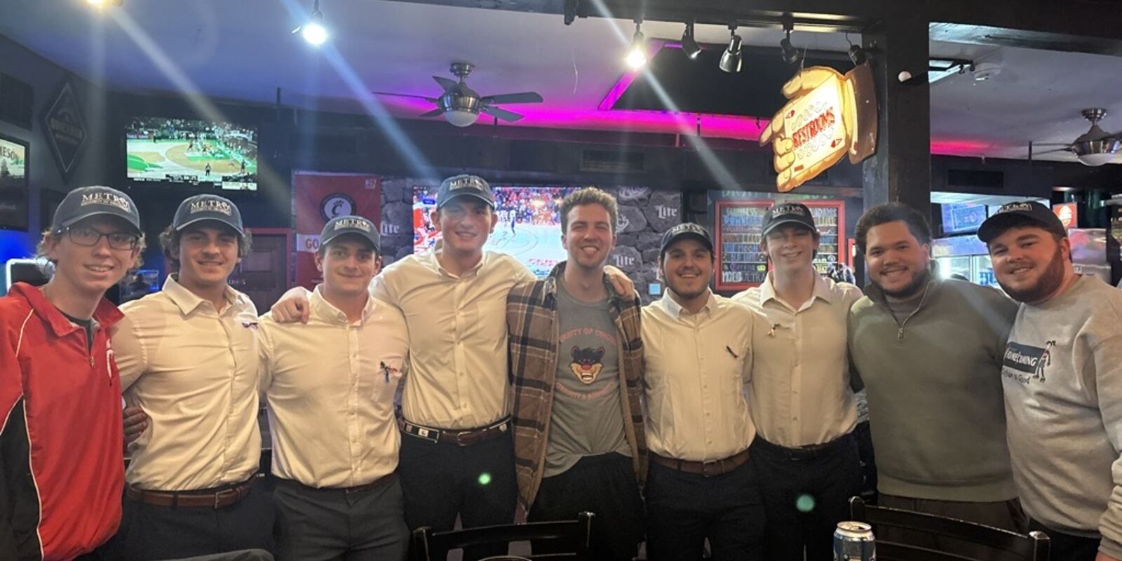 A group wearing METRO hats gathered at a Cincinnati restaurant